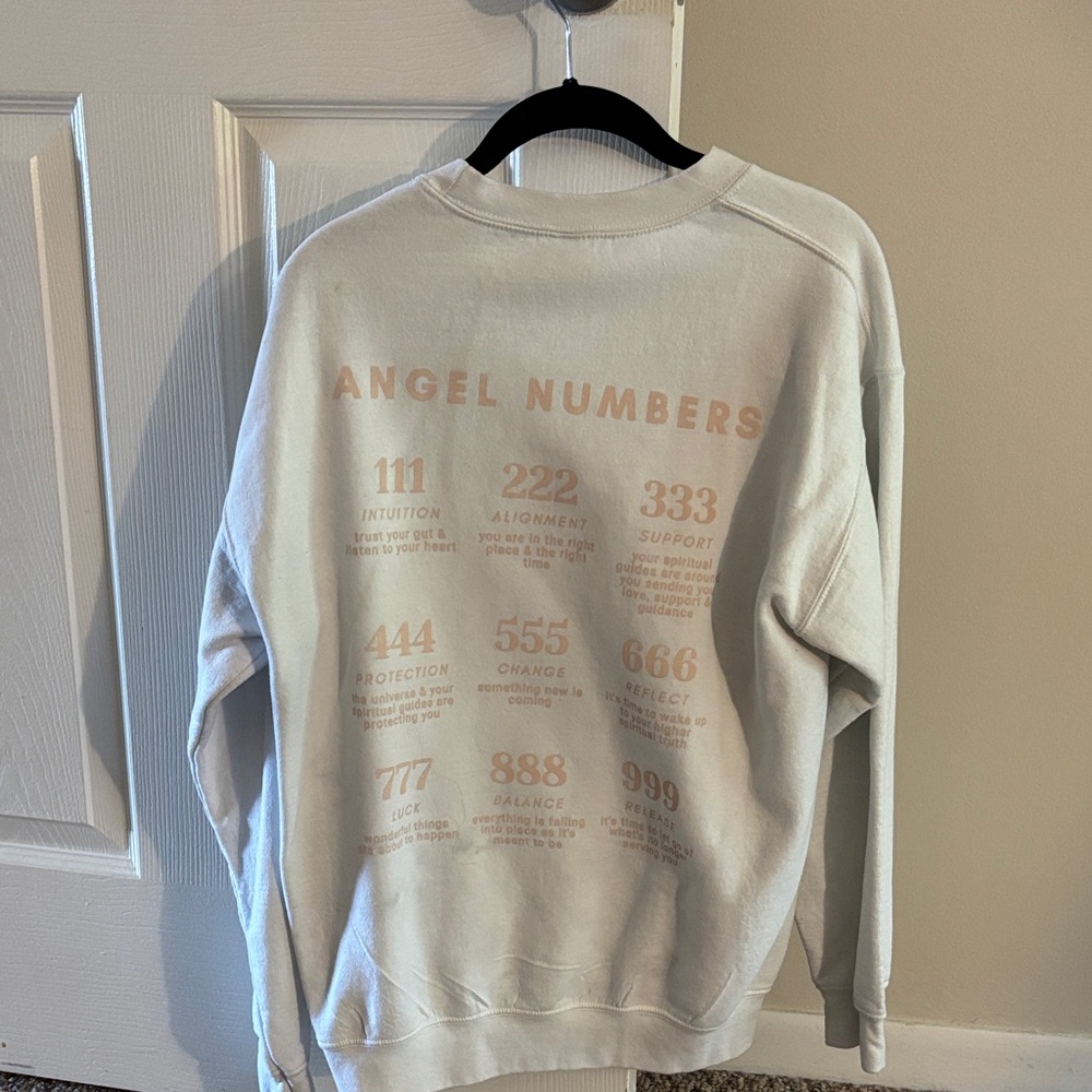 White Smiley Face with Angel Numbers on the back womens sweater